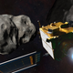 An illustration of the DART spacecraft approaching the asteroid.